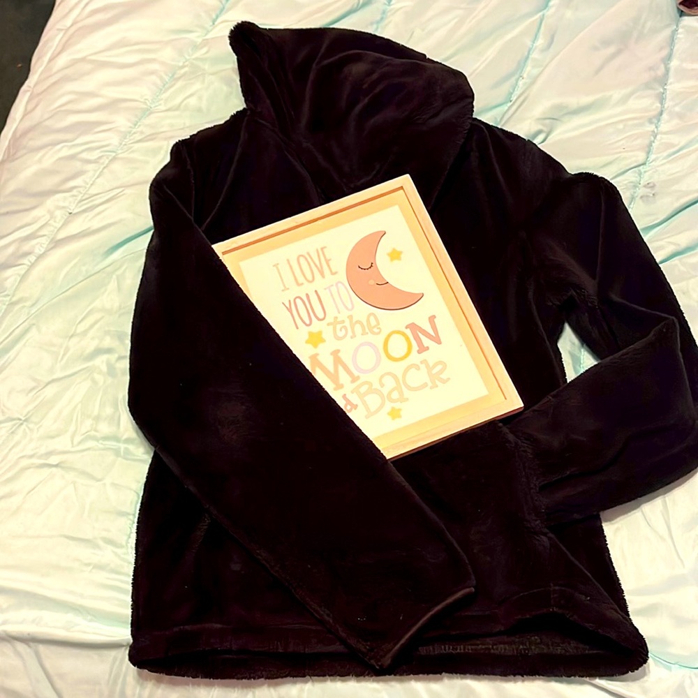 I am selling a black wonder nation sweater and it is vary soft